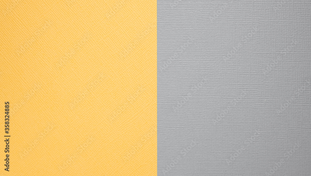 Fototapeta premium Two-color paper background. The background is yellow and grey, divided equally.