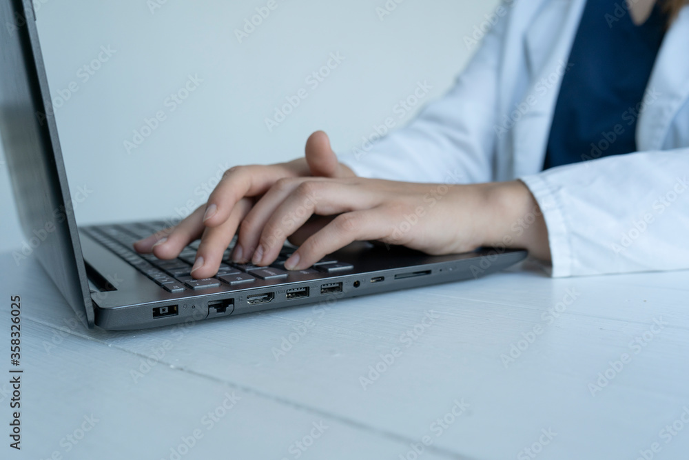 Doctor works at a computer, laptop Doctor works at a computer, laptop