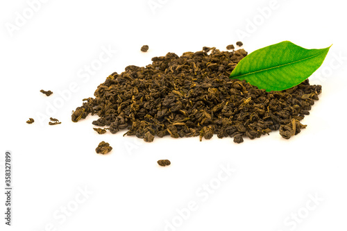 Heap of tea green, black with green leaf plant. Isolated on white background.