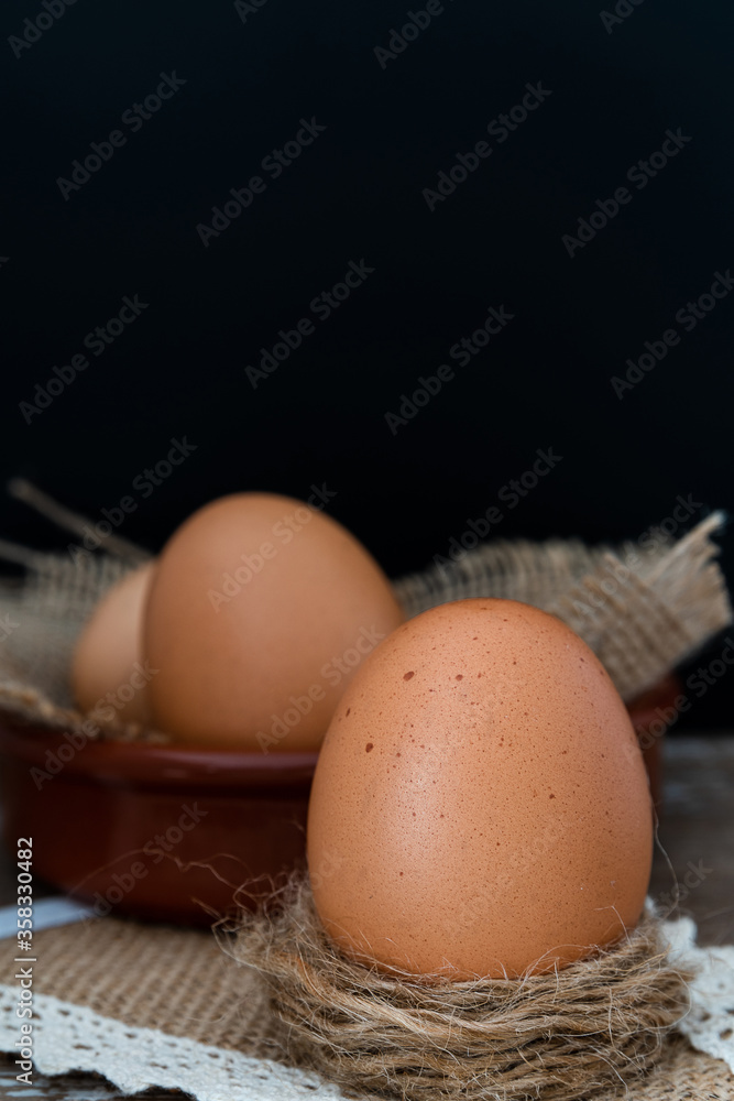 Fresh brown eggs on a rustic table