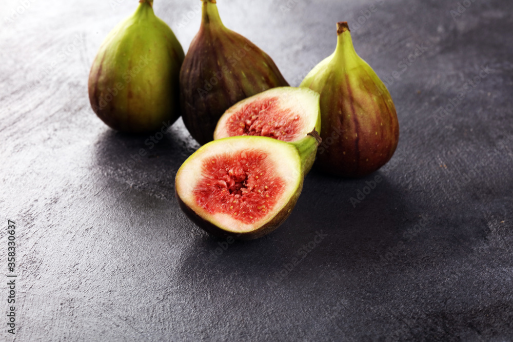 Fresh figs. Fruit with half and hole figs on vintage background. Fresh figs. Fruit with half and hole figs on vintage background.