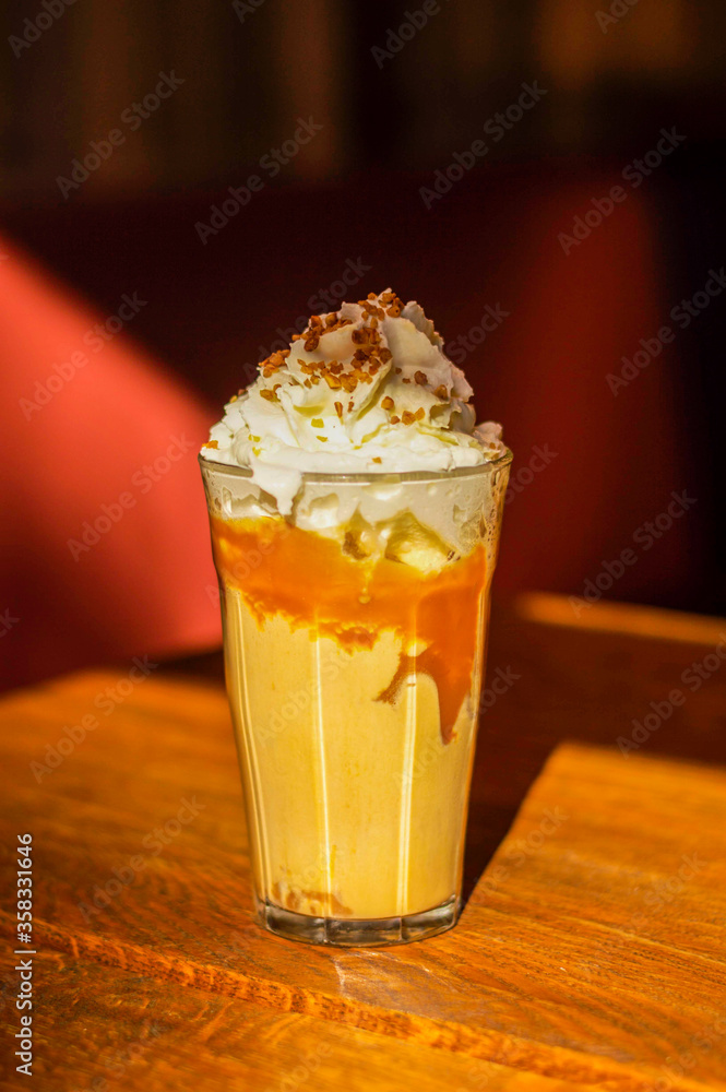 Refreshing and stimulating iced coffee with whipped cream and nuts Refreshing and stimulating iced coffee with whipped cream and nuts