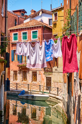 Canal and drying linen outdoor in Venice © Roman Sigaev