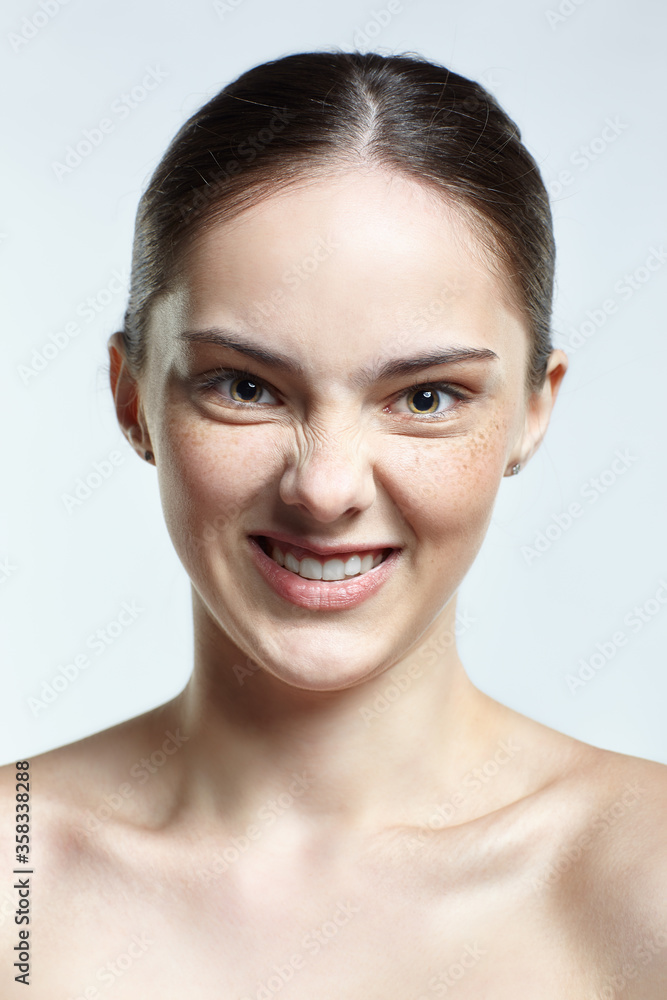 Headshot of emotional female face portrait with fury facial expression. Headshot of emotional female face portrait with fury facial expression.