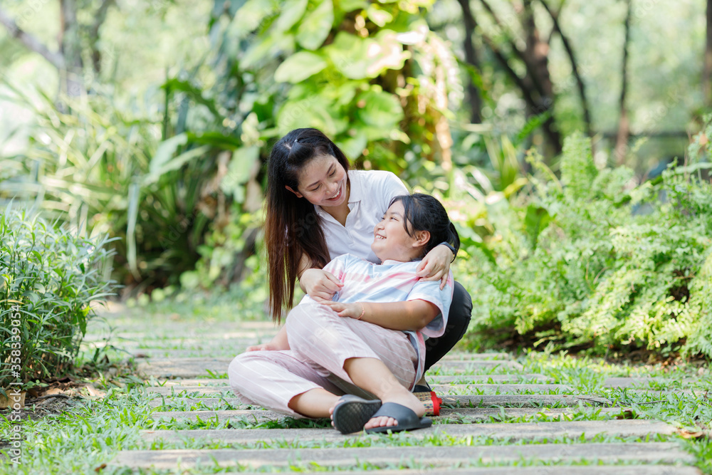 Fototapeta premium Mom and daughter funny on holiday in the park.