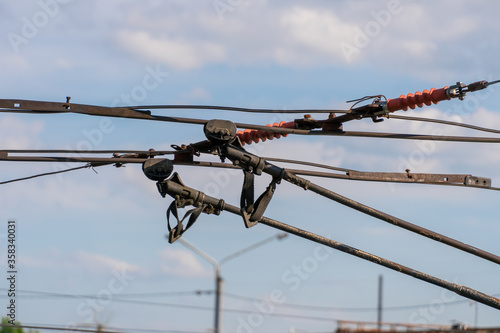 Obraz na plátně Trolleybus horns, wires on the line for trolleybuses close-up against the sky