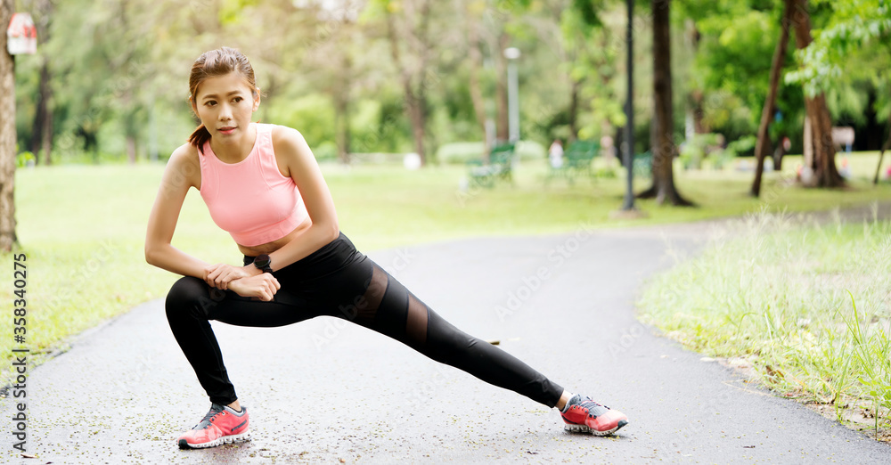 Lifestyle Happy Asian women is Workout in the great outdoors or the beautiful nature park. Enjoying the physical activity in the summer. Concept Good health Lifestyle Happy Asian women is Workout in the great outdoors or the beautiful nature park. Enjoying the physical activity in the summer. Concept Good health