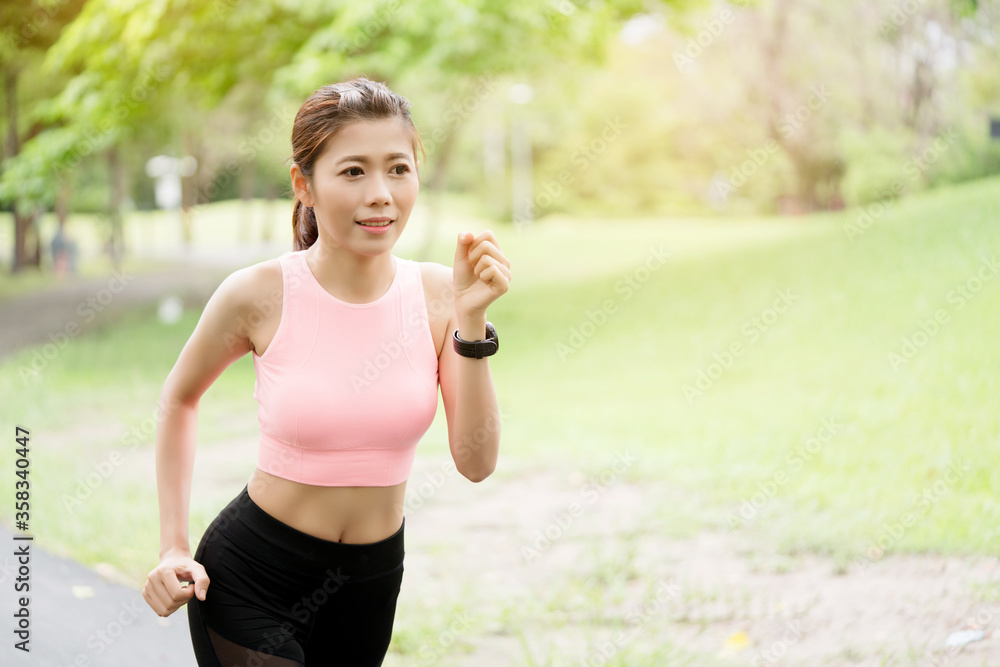 Lifestyle Happy Asian women is running in the great outdoors or the beautiful nature park. Enjoying the physical activity in the summer. Concept Workout Lifestyle Happy Asian women is running in the great outdoors or the beautiful nature park. Enjoying the physical activity in the summer. Concept Workout