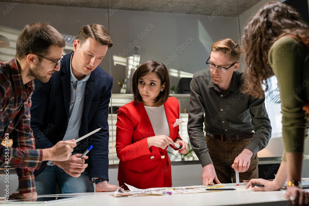 Architects Team Are Working On Paper Blueprint. Business Woman Suggest Idea To Designer. Concept Of Construction, Architecture, Development And Creative. Architects Team Are Working On Paper Blueprint. Business Woman Suggest Idea To Designer. Concept Of Construction, Architecture, Development And Creative.