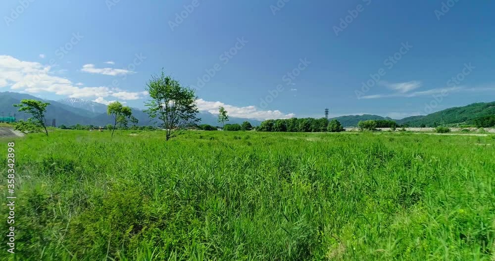 Aerial : Summer mountain and paddy field in Japan Aerial : Summer mountain and paddy field in Japan