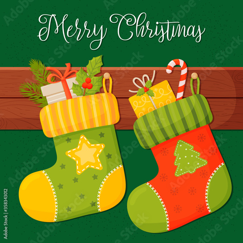 Christmas socks with gifts, on a green background. Vector illustration