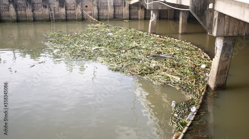 buoy entrap garbage  in canal , prevent  wastrel float to the sea