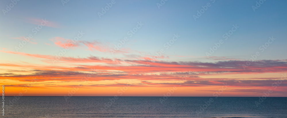 Sunrise over Gulf of Mexico on  St George Island in the panhandle or forgotten coast area of Florida in the United States