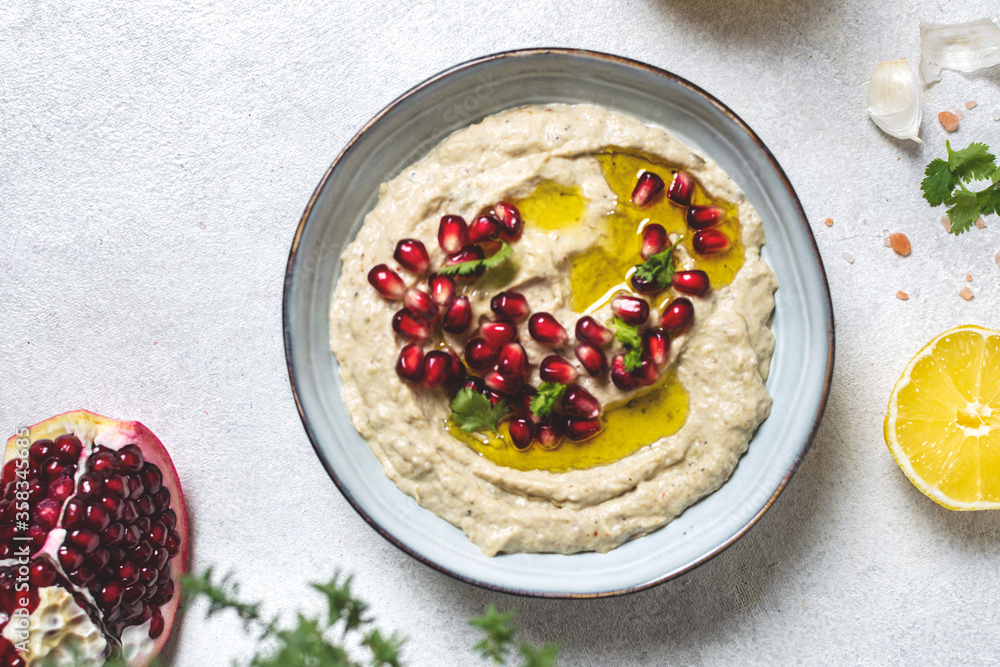 Levantine appetizer Baba ghanoush baked eggplant appetizer served with pomegranate seeds Levantine appetizer Baba ghanoush baked eggplant appetizer served with pomegranate seeds