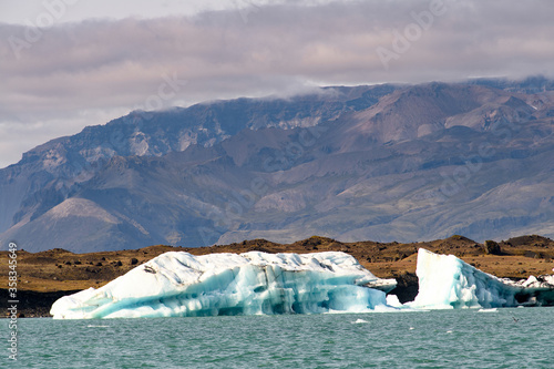 Ice floating in Jokulsarlon, a large glacial lake in southeast Iceland, Vatnajokull National Park photo