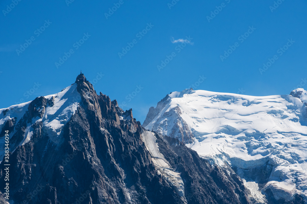 View of Aiguille du Midi in Mont Blanc massif within the French Alps in summer from Plan Praz.