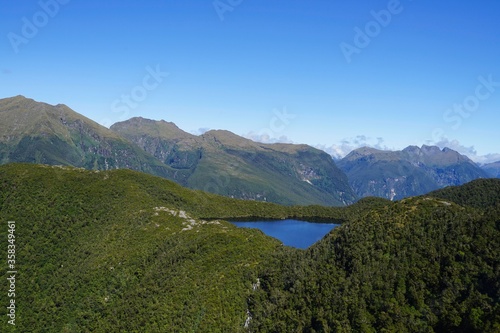 Lake in crest - Fjordland National Park - Doubtful Sound from above.