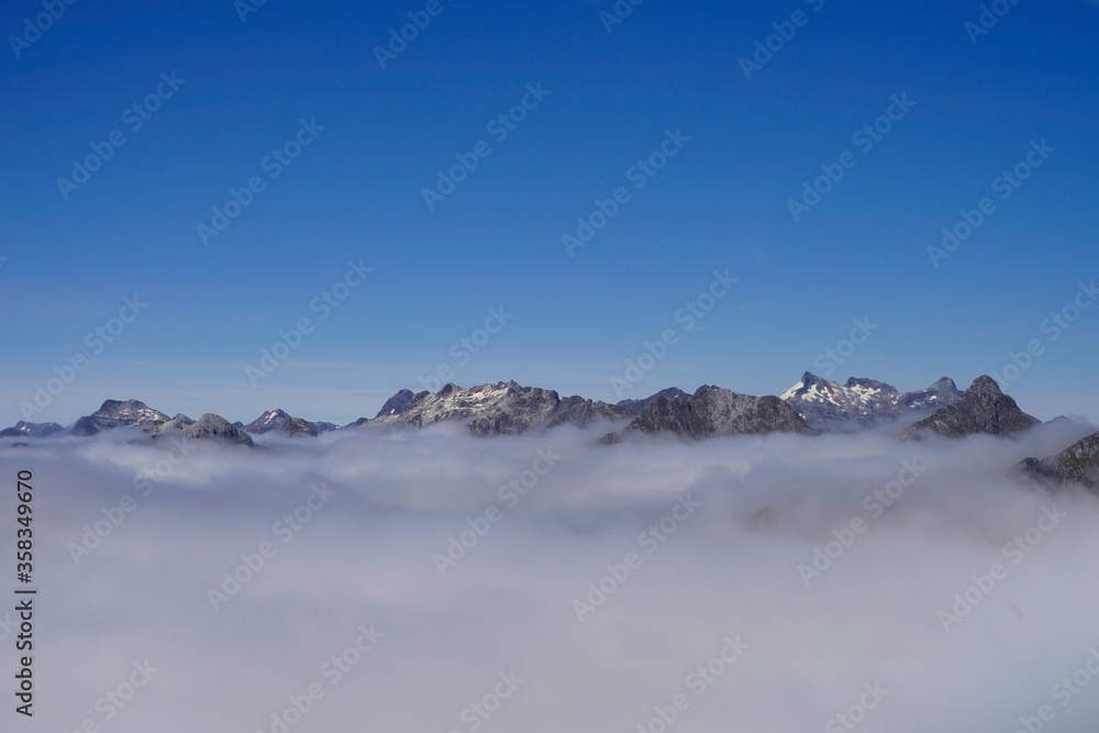 Fjordland National Park - cloudy mountain peaks over Doubtful Sound.