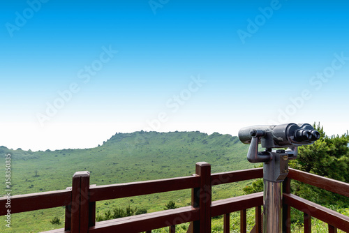 Coin-operated binoculars in Crater View of Songsan Ilchulbong on jeju island. photo