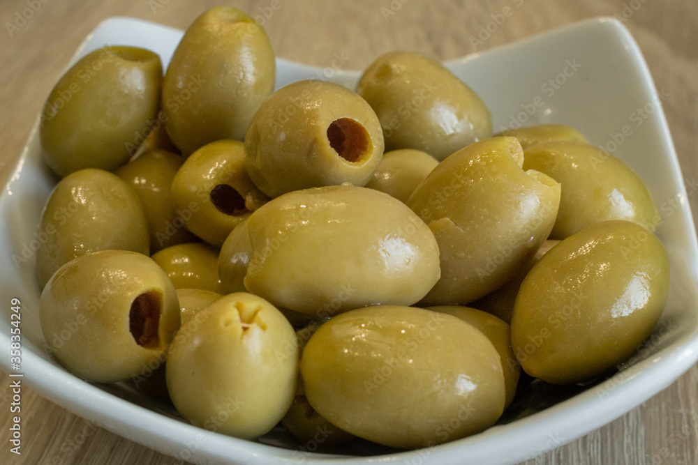 Pitted green olives. Snack for vermouth. Ingredient for greek salad. Greek fruit. Spanish olives. Vegetarian food. Canned vegetables. Healthy foods. Healthy eating. Pitted green olives. Snack for vermouth. Ingredient for greek salad. Greek fruit. Spanish olives. Vegetarian food. Canned vegetables. Healthy foods. Healthy eating.