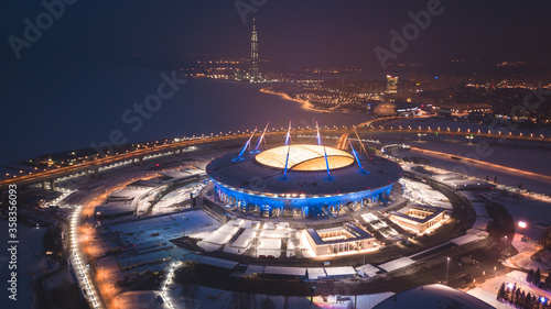 Beautiful aerial view from the bird's eye view of the Gulf of Finland, Saint-Petersburg, Russia, with a stadium, western rapid diameter and cable-stayed bridge, view from quadrocopter drone flight