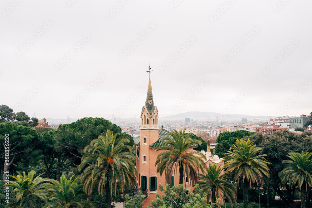 Gaudi House Museum in the Park Guell, wide photo, against the backdrop of the city of Barcelona.