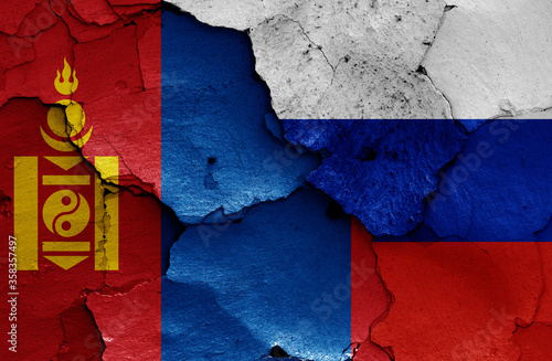 flags of Mongolia and Russia painted on cracked wall