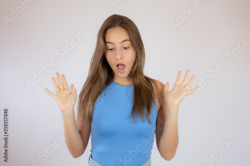 Wallpaper Mural Pretty young girl making surprise gesture Torontodigital.ca