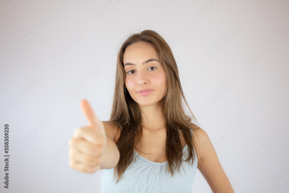 Pretty young girl making finger up gesture Pretty young girl making finger up gesture