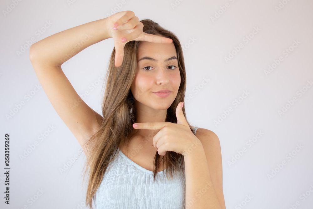 Pretty young girl making portrait gesture Pretty young girl making portrait gesture