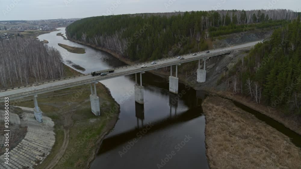 Aerial view of the bridge over the river that cars ride. Aerial view of the bridge over the river that cars ride.