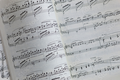 View of a book with turned page with music notes or notation