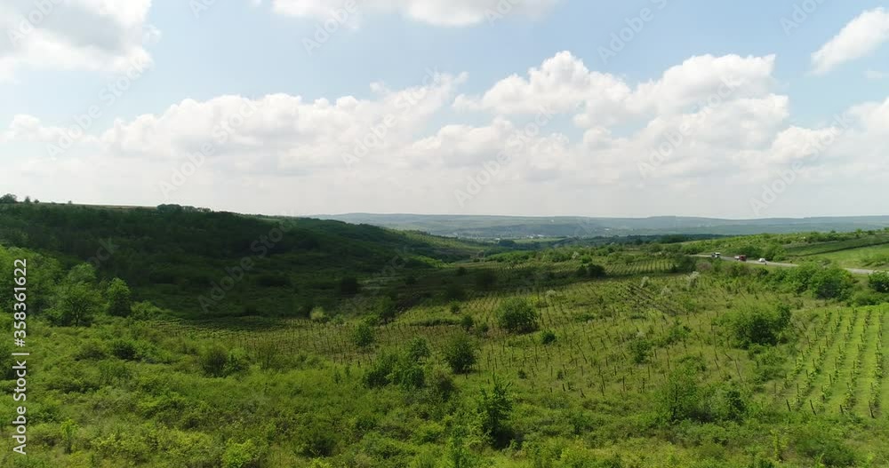 Beautiful view of the hills from a height against a background of white clouds Beautiful view of the hills from a height against a background of white clouds