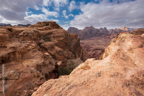 Top view of the empty valley of the city of Petra from a trekking trail with rocks under the hot sun.  Desert mountain landscape in Jordan © Lana Kray