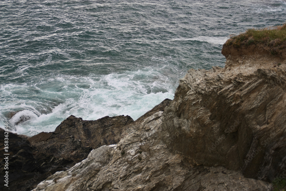 Dangerous waves crashing on rocks