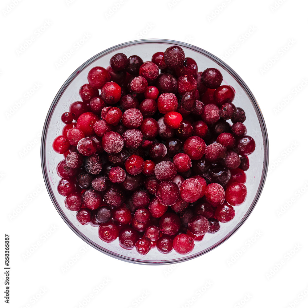 isolated object on a white background - frozen small red berries of wild cranberries in a glass transparent plate isolated object on a white background - frozen small red berries of wild cranberries in a glass transparent plate