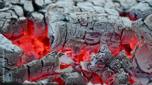 slow smoldering of hot coals on the grill