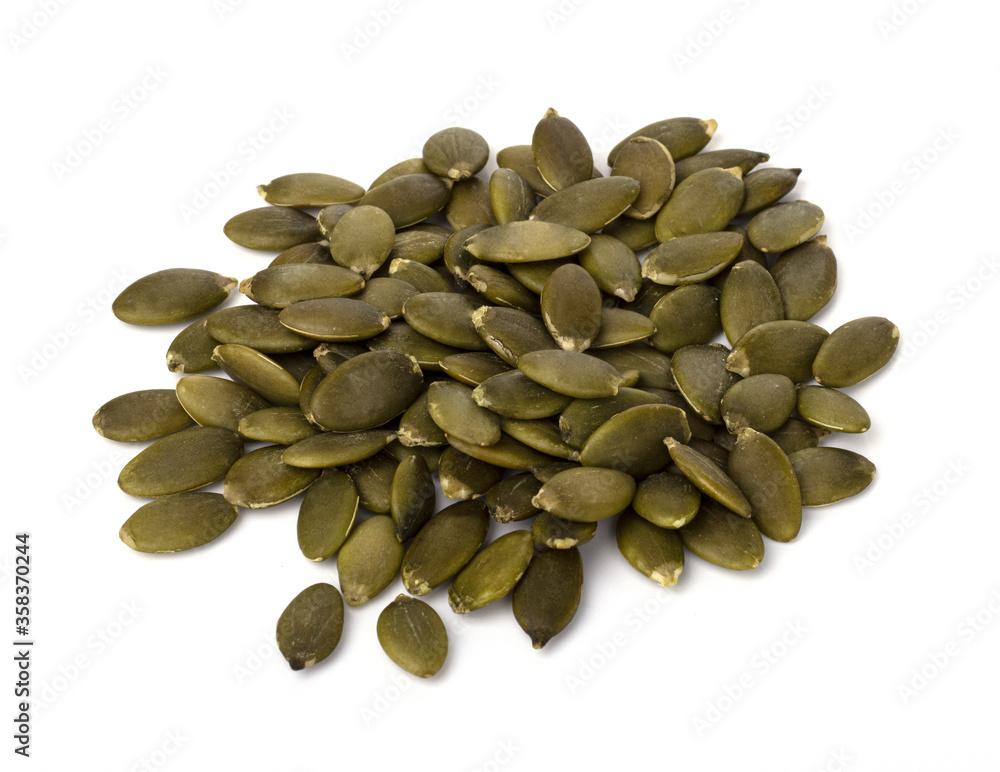 raw pumpkin seeds isolated on a white background. proper nutrition and weight loss raw pumpkin seeds isolated on a white background. proper nutrition and weight loss