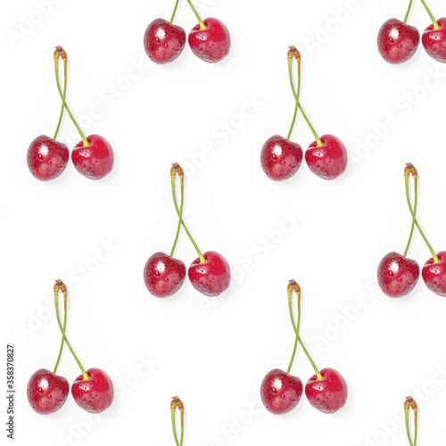 Cherries with water drops on white background. Pattern of ripe cherry berries pattern