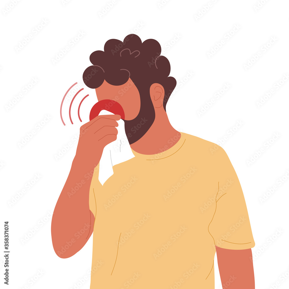 Young man blowing nose into handkerchief Young man blowing nose into handkerchief