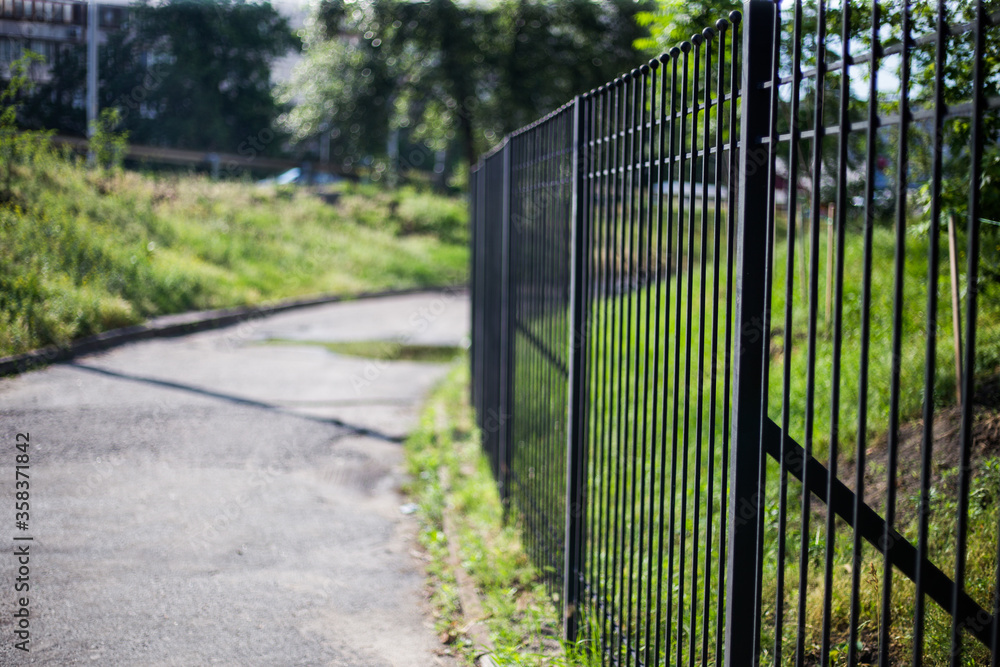 Old abandoned fence on the street