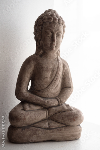 buddga figure in room interior photo