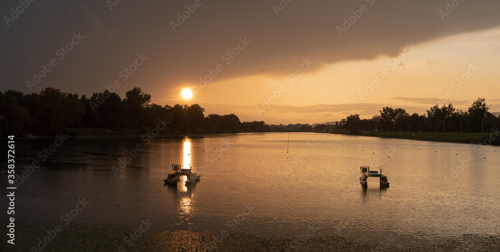 Fototapeta premium Scenic sunset at Jarun lake during rain, Zagreb, Croatia.