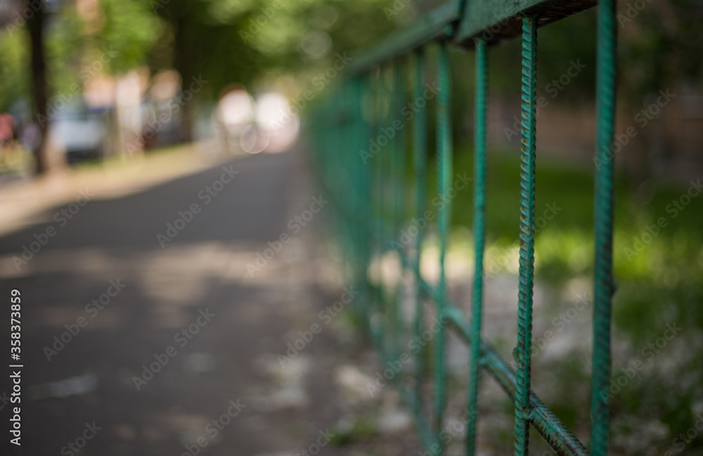 Old abandoned fence on the street