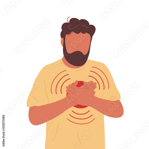 Young man with heart pain touching his chest