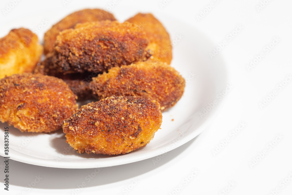 crispy homemade croquettes on a white plate crispy homemade croquettes on a white plate