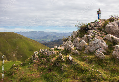 Statue of God Mother with Jesus baby in Pyrenees mountains, France. Sculpture of Our Lady and Jesus Christ on mountain top. Scenic mountains landscape with Mary Virgin statue. Pray and silence concept