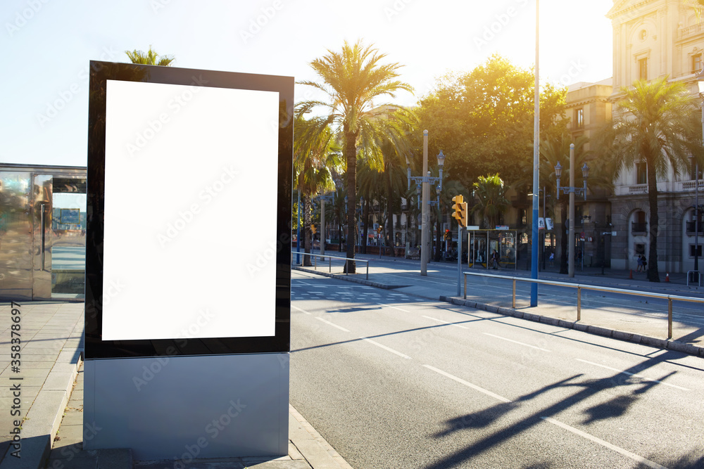 Blank billboard with copy space for your text message or content, outdoors advertising mock up, public information board on city road, flare sun light. Empty Lightbox on urban setting sidelines Blank billboard with copy space for your text message or content, outdoors advertising mock up, public information board on city road, flare sun light. Empty Lightbox on urban setting sidelines