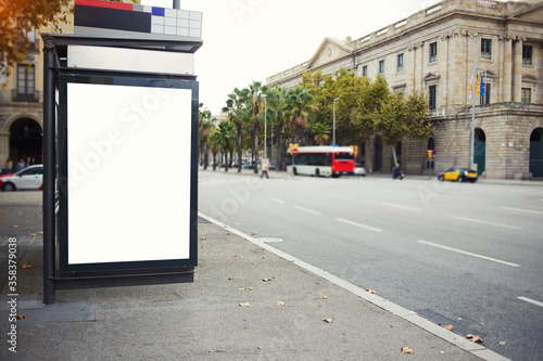 Blank electronic billboard with copy space for your text message or promotional content, public information board in the big city, advertising mock up, empty banner in metropolitan city at day