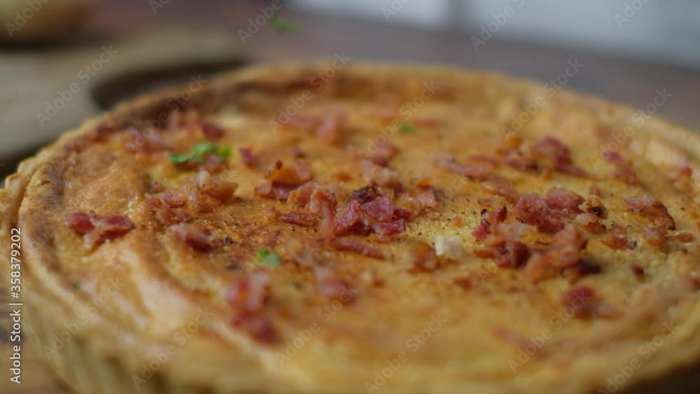 Chef hand decorating quiche by sprinkle topping on top. slow motion vdo. Chef hand decorating quiche by sprinkle topping on top. slow motion vdo.